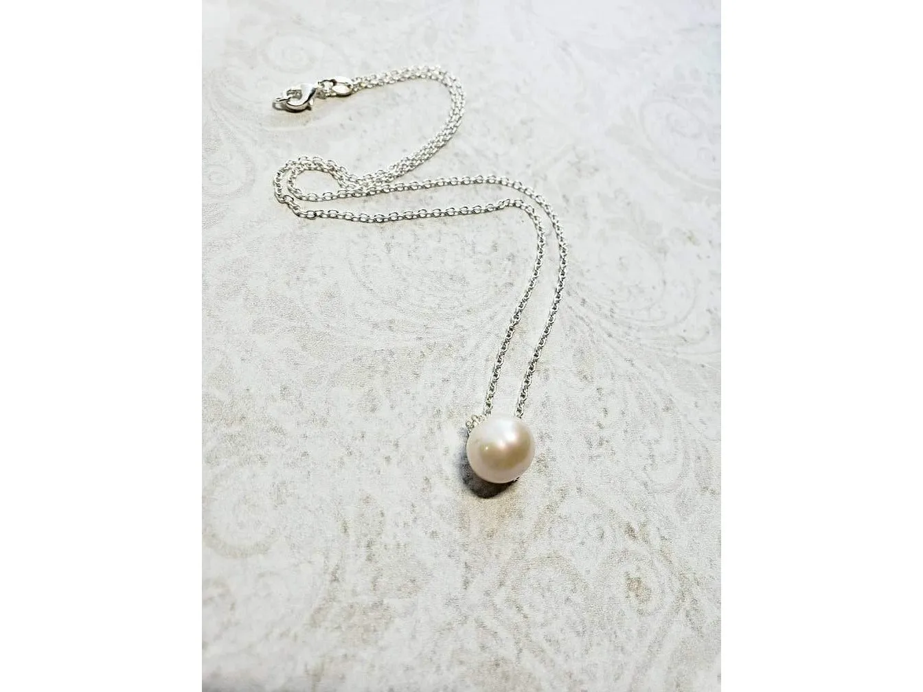 Floating Single pearl necklace